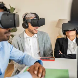 professional team wearing virtual reality headsets